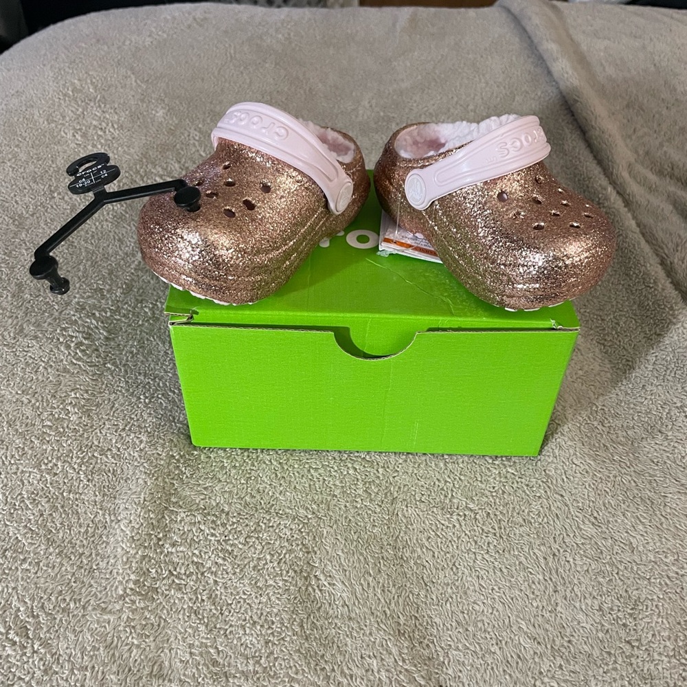 Gold glitter crocs size c4